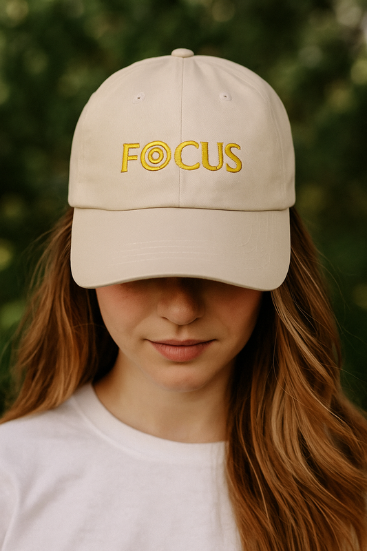 FOCUS Embroidered Dad Cap — White Baseball Hat with Yellow Target Logo